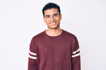 Young handsome hispanic man over white background with a happy and cool smile on face. lucky person.