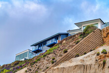 Oceanfront Houses On The Coast Of San Diego California With Overcast Blue Sky