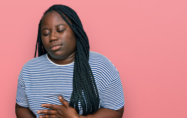 Sticker - Young black woman with braids wearing casual clothes with hand on stomach because indigestion, painful illness feeling unwell. ache concept.