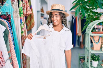 Wall Mural - Young african american woman smiling happy at retail shop