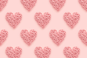 Wall Mural - Hearts pattern for Valentines Day on pink background. Abstract, flat lay.