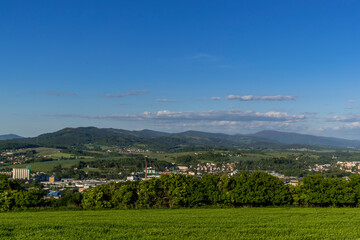 Wall Mural - Views of the hills and surrounding city with views of the surrounding hills in the background of a blue sky with white clouds.