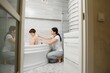 © Serhii - Mother washing little son in bathroom