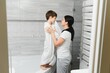 © Serhii - Mother washing little son in bathroom