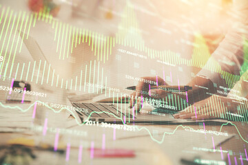 Wall Mural - Multi exposure of woman hands typing on computer and financial chart hologram drawing. Stock market analysis concept.