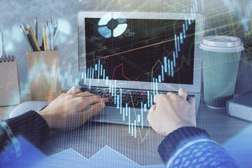 Fototapete - Double exposure of woman hands typing on computer and forex chart hologram drawing. Stock market invest concept.