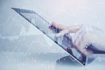 Fototapete - Multi exposure of man's hands holding and using a digital phone and forex graph drawing. Financial market concept.