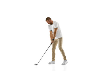 Wall Mural - Checking. Golf player in a white shirt practicing, playing isolated on white studio background with copyspace. Professional player practicing with bright emotions and facial expression. Sport concept.