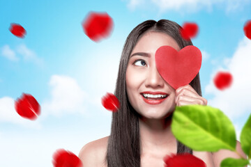 Asian woman holding the red heart