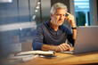 © goodluz - Portrait of senior man with grey hair connected with laptop