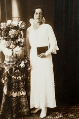 Wall Mural - Germany - CIRCA 1920: Full body shot of young women with bible in studio Vintage Carte de Viste Edwardian era photo