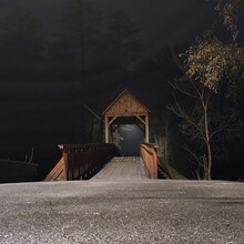 Photo Of A Wooden Bridge At Night.