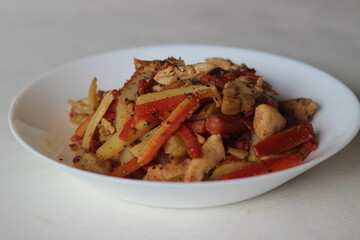 Wall Mural - Stir fried potatoes carrots and chicken for lunch