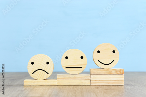 Obraz Dibond Concept image of satisfaction level. wooden circles with emotions