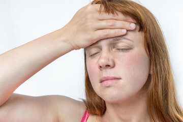 Wall Mural - Woman with headache or migraine is holding her aching forehead