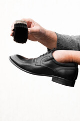 Leather shoe care. Cleaning leather shoes with black shoe cream