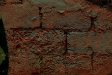 Background Texture With Close Up Detail Of Old Weathered Red Bricks In A Wall In A Full Frame View