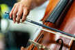 close up of a person playing the cello