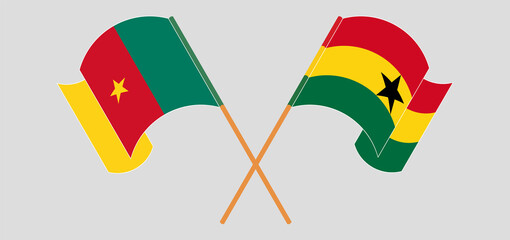 Crossed and waving flags of Cameroon and Ghana