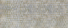 Granite Cobblestoned Pavement Background. Stone Pavement Texture. Abstract Background Of Cobblestone Pavement Close-up. Seamless Texture.