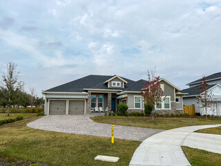 Wall Mural - A luxury gray house in the Laureate Park neighborhood