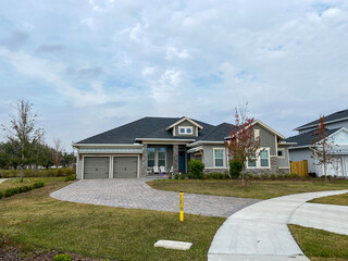 Wall Mural - A luxury gray house in the Laureate Park neighborhood