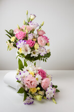 Mock Up Two Bouquets Of Different Sizes Of Roses, Daisies, Lisianthus, Chrysanthemums, Unopened Buds In A White Paper Box On A White Background, One Bouquet Is On The Table.
