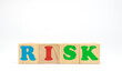 © zerbob2 - Multicolored cubes on white background word risk