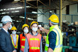 © Stella - Foreman hold digital thermometer, measure temperature for screen workers with face mask, prevent against infection of Covid-19 outbreak, industrial engineers in line at manufacturing industry factory