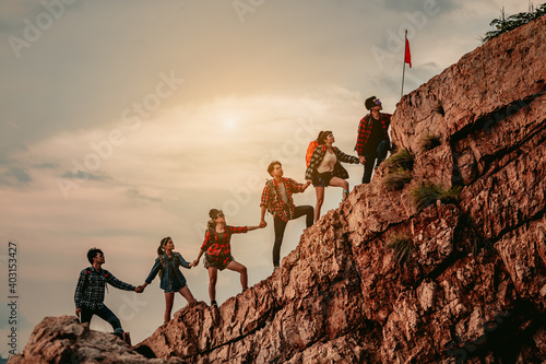 Group of people on peak mountain climbing helping teamwork , travel trekking success business concept.