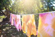 Natural Color Dye T-shirt Hanging On Plastic Rope At The Garden, Outdoor Day Light, Natural Color Dyeing Workshop In Thailand