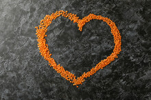 Heart Made Of Red Legumes On Black Smokey Background