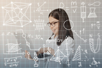 Little girl with laptop studying exact mathematical sciences. Concept of online education