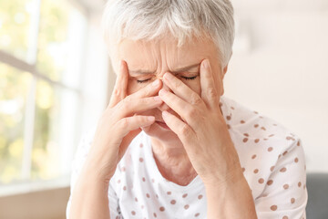 Sticker - Stressed senior woman suffering from headache