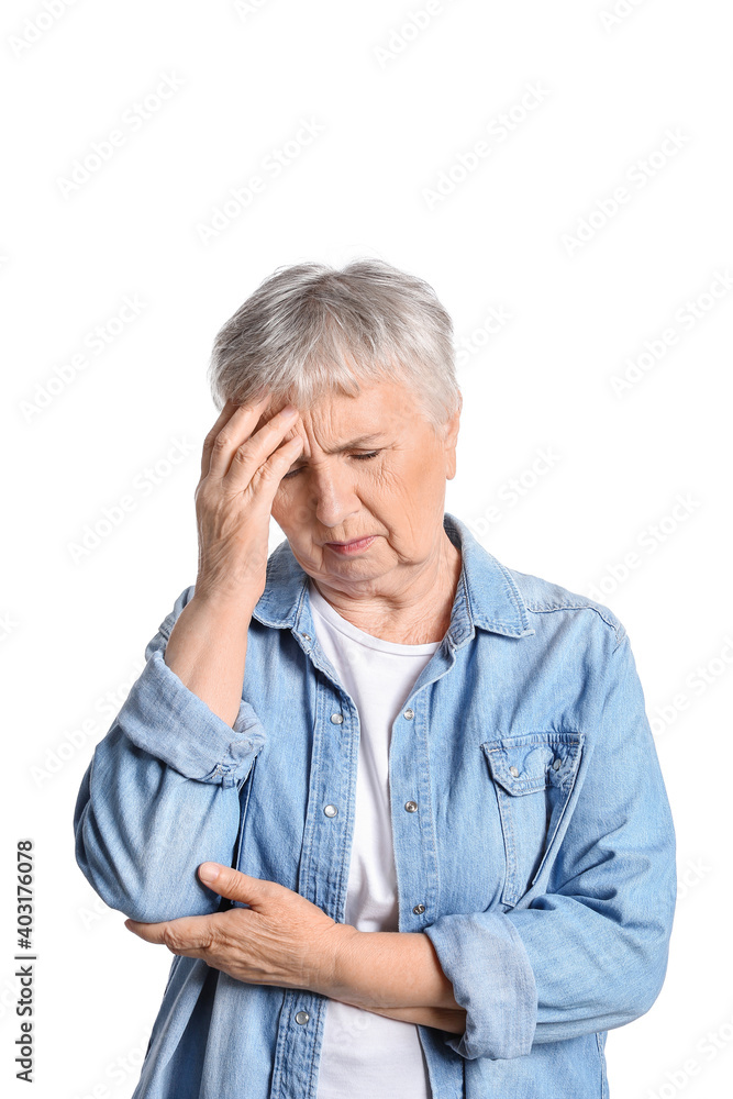 Stressed senior woman suffering from headache isolated on white background