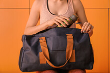 Woman With Sport Bag In Gym Locker Room