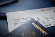 © Christian - American passport and airplane ticket above a seat