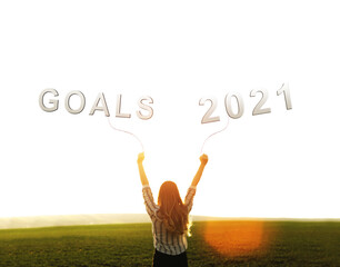 Young woman with fists in the air  with goals in year 2021. Feeling motivated,  courage and strength concept. Business success and development.