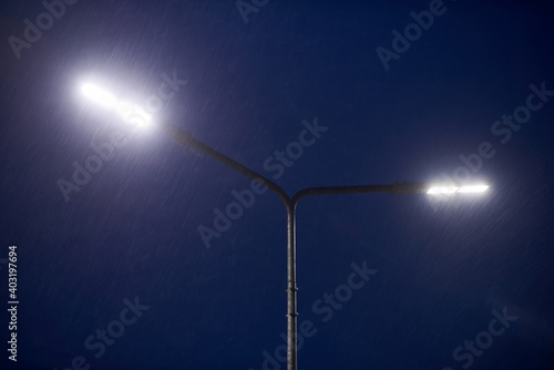 Plakat an image of street light on blue sky in snowy weather