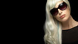 © Casther - Fashion portrait of an attractive blond woman in sunglasses on black background