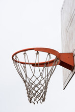 Basketball Hoop, Basket With White Net And White Blown Up Sky In Background