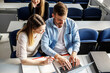 © BalanceFormCreative - Couple of students working together on some task.They sitting in classroom and learning together.