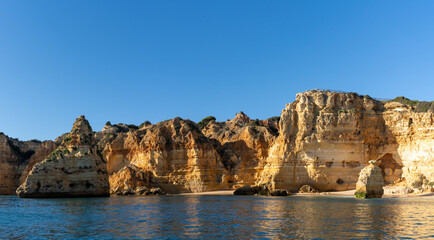 Poster - the beaches and cliifs of the Algarve Coast in Portugal under bright blue sky