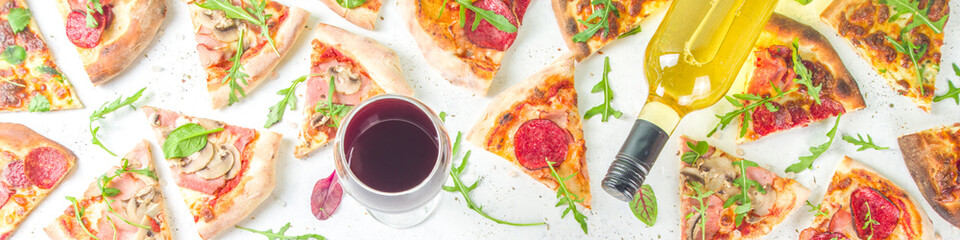 Wall Mural - Pizza party concept.  Set of pizzas with various fillings, Pieces of different pizza, glass and bottle with wine. Flatlay top view copy space on white background