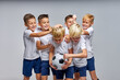 © Roman - boys soccer team celebrating a victory after match, motivated children sports team have fun, laugh and celebrate