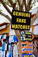 IZMIR, TURKEY: "Genuine Fake Watches" Sign For Counterfeit, Phony, Replica Watches And Other Souvenirs. The Souvenir Market With Mannequin And Wares For Sale.