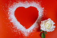 White Heart Shape On Red Background With White Rose.