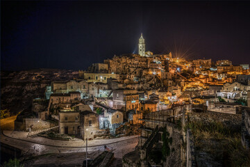 Wall Mural - Beautiful night cityscape of Matera with the cathedral in the highest point of the city, Basilicata, Italy