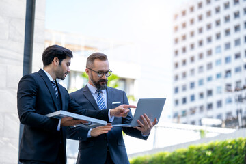 Businessmen discuss business partners about renewable energy solar panels,Concept: renewable energy, technology, electricity, service, green power.