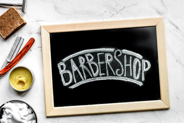 Wall Mural - Tools for cutting beard in barbershop on workplace background top view